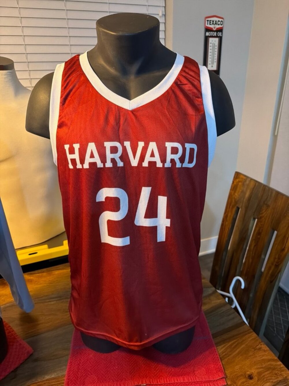 Harvard Crimson basketball jersey, specifically matching the warmup gear
